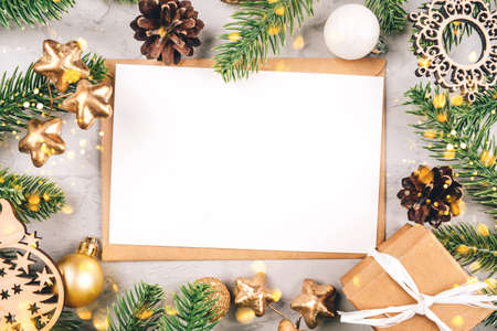 Christmas composition of fir tree branches and decorations. The concept of the winter holidays. Flat lay, top view, copy space.の写真素材