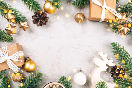 Christmas background of fir tree branches and decorations. The concept of the winter holidays. Flat lay, top view, copy space.の写真素材