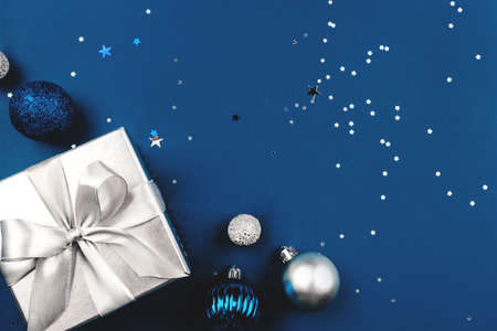 Blue Christmas background of gift box and decorations. The concept of the winter holidays. Flat lay, top view, copy space.の写真素材