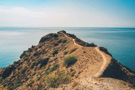View of the path leading to the cape above the sea. Sudak, Crimea. The concept of active tourism.の写真素材