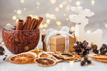 The figure of the reindeer, gift box and dry spices. Christmas decor, winter mood, holiday decoration.の写真素材