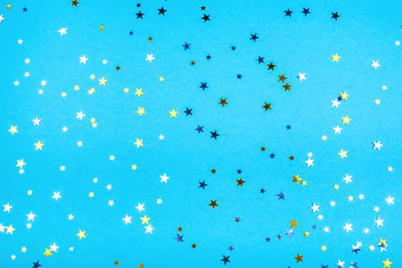 Golden and silver stars on blueの写真素材