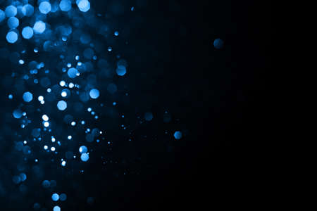 Abstract bokeh on dark blue background. Holiday conceptの写真素材