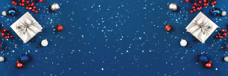 Blue Christmas background of gift box and decorations. The concept of the winter holidays. Flat lay, top view, copy space.の写真素材