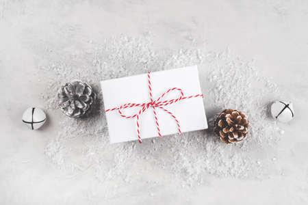 Festive Christmas background with white gift box and Christmas decorations.の写真素材