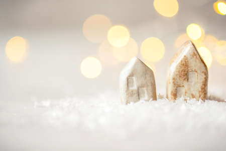 Ceramic figurines of houses in the snow. Christmas decor, winter mood, holiday decoration.の写真素材
