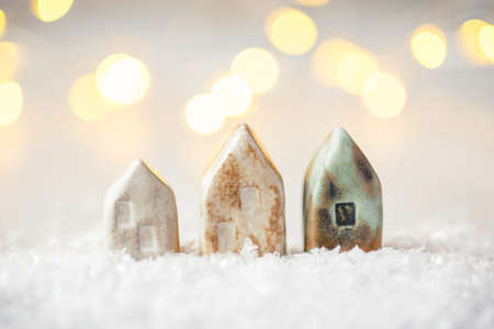 Ceramic figurines of houses in the snow. Christmas decor, winter mood, holiday decoration.の写真素材