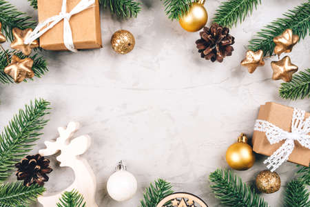 Christmas background of fir tree branches and decorations. The concept of the winter holidays. Flat lay, top view, copy space.の写真素材