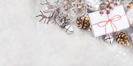Festive Christmas background with white gift boxes and Christmas decorations.の写真素材