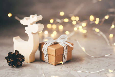 The figure of the reindeer, gift box and pine cone. Christmas decor, winter mood, holiday decoration.の写真素材