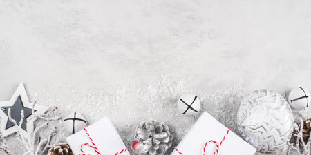 Festive Christmas background with white gift boxes and Christmas decorations.の写真素材
