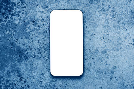White screen of modern mobile phone for mockup. Blue background.の写真素材