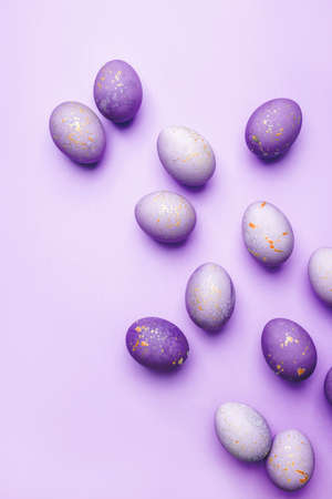 Easter frame of eggs painted in purple color. Flat lay, top view. Copy space for text.の写真素材