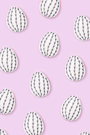Easter egg and bunny cookies on pink background. Spring holiday.