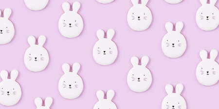 Pattern of Easter bunny cookies on lilac background. Spring holiday.の写真素材