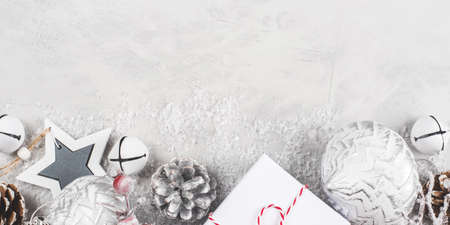 Festive Christmas background with white gift boxes and Christmas decorations.の写真素材