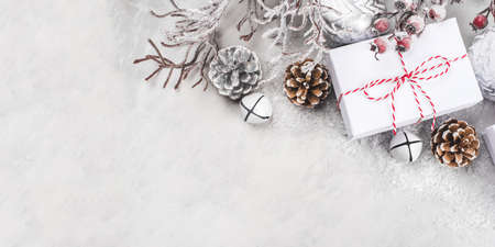 Festive Christmas background with white gift boxes and Christmas decorations.の写真素材