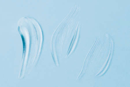 Smears of gel on a blue background.の写真素材