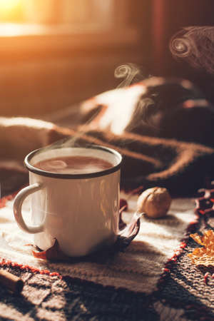 Autumn hot steaming cup of coffee or tea.の写真素材