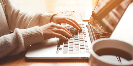 Young woman working in home on her laptop computer.の写真素材