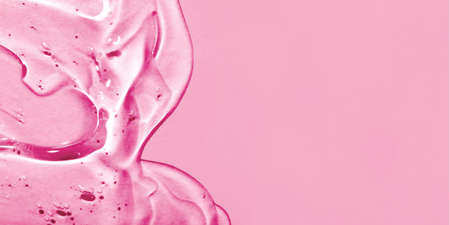 Transparent hyaluronic acid gel on a blue background.の写真素材