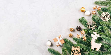 Christmas composition of fir tree branches and decorations.の写真素材