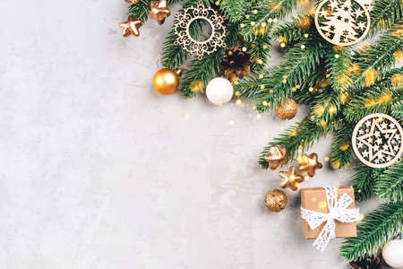Christmas composition of fir tree branches and decorations.の写真素材