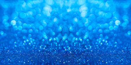 Blue sparkle background with bokeh.の写真素材