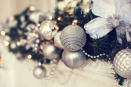 Silver Christmas balls on a fir branch.の写真素材