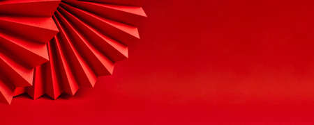 Minimalistic background made of red paper.の写真素材