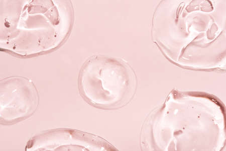 Transparent hyaluronic acid gel on a pink background.の写真素材