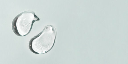 Transparent hyaluronic acid gel on a gray background.の写真素材
