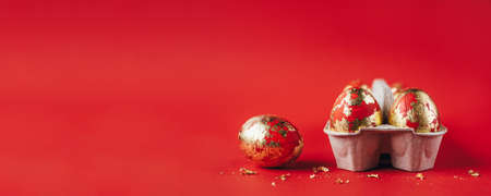 Red painted Easter eggs on red backgroundの写真素材