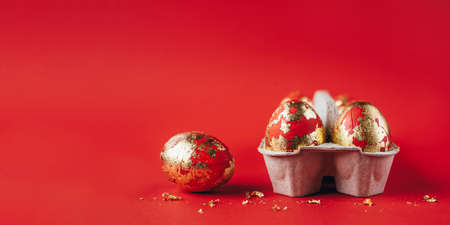 Red painted Easter eggs on red backgroundの写真素材