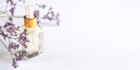 Transparent dropper bottle with cosmetic product for skin care, natural cosmetics.の写真素材