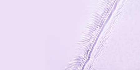 The texture of water on a lilac background.