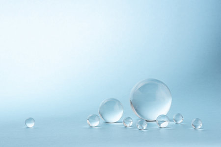 Blue background with transparent glass balls.の写真素材