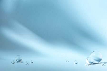 Blue background with transparent glass balls.の写真素材