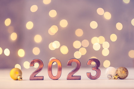 Metal numbers 2023 on table with bokeh lights.の写真素材