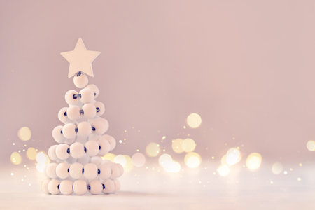 Christmas tree on table with bokeh lights.の写真素材