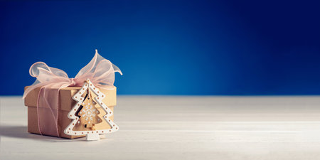 Gift box and Christmas tree on the table.の写真素材
