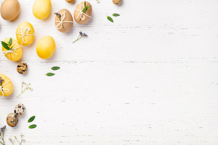 Easter eggs with flowers on a white table.の写真素材