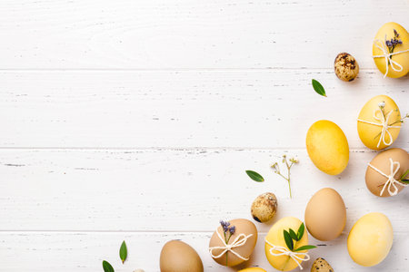 Easter eggs with flowers on a white table.の写真素材