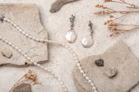 Beautiful Pearl Jewelry on white sand.の写真素材