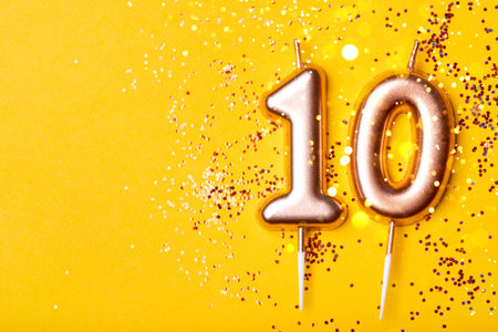 Gold candle in the form of number ten.の写真素材
