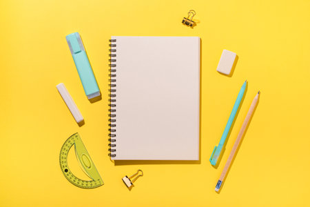 school supplies on yellow background. Back to school concept. top view. copyspace.