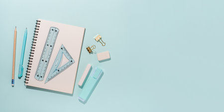 school supplies on blue background. Back to school concept. top view. copyspace.の写真素材