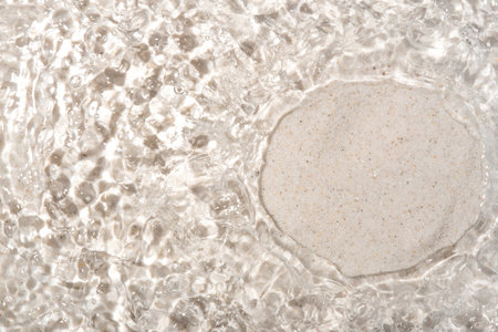 The texture of water on a sand background.の写真素材