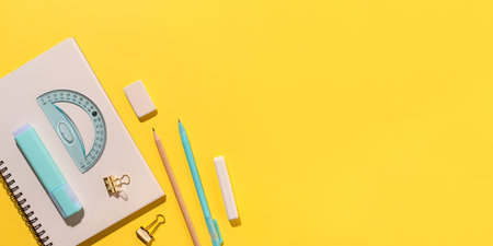 School supplies on yellow background.の写真素材
