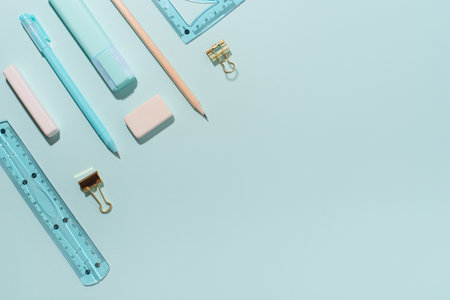 School supplies on blue background.